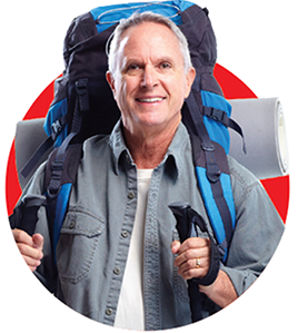 Smiling retiree with a large backpacking bag on their back, ready for adventure